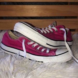 Hot pink Converse tennis shoes